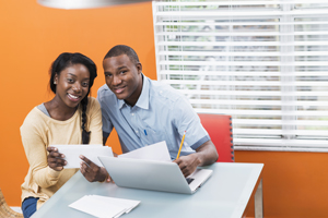 Young couple looking at their bills